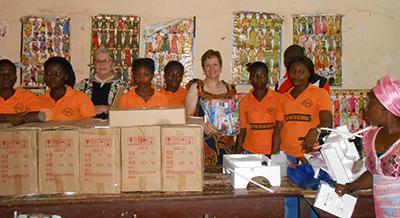Kim Spillman and Marcia Rasner deliver sewing machines to the sewing cooperative in the village of Aseseeso