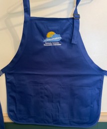A Kentucky homemakers Association blue apron with the log in color.  Apron has two pockets and is adjustable.