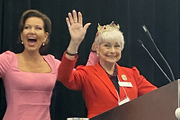 Photo by Sharon Fields Keynote speaker Heather Renee French Henry concluded her inspiring remarks by temporarily “crowning” KEHA’s State President Brenda Hammons with her 2000 Miss America crown. Ms. Henry also gifted KEHA 1st Vice President Ann Porter with a superhero cape in keeping with her speech theme about how your superpower equals your talent plus your heart.